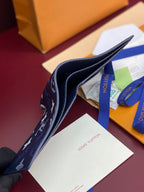 Louis Vuitton small wallet profile with navy monogram exterior and blue inner lining
