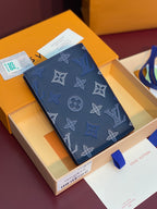 Louis Vuitton small card wallet, dark blue monogram print with corner detail
