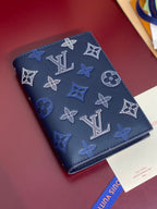 Louis Vuitton small card wallet, dark blue monogram pattern with visible stitching