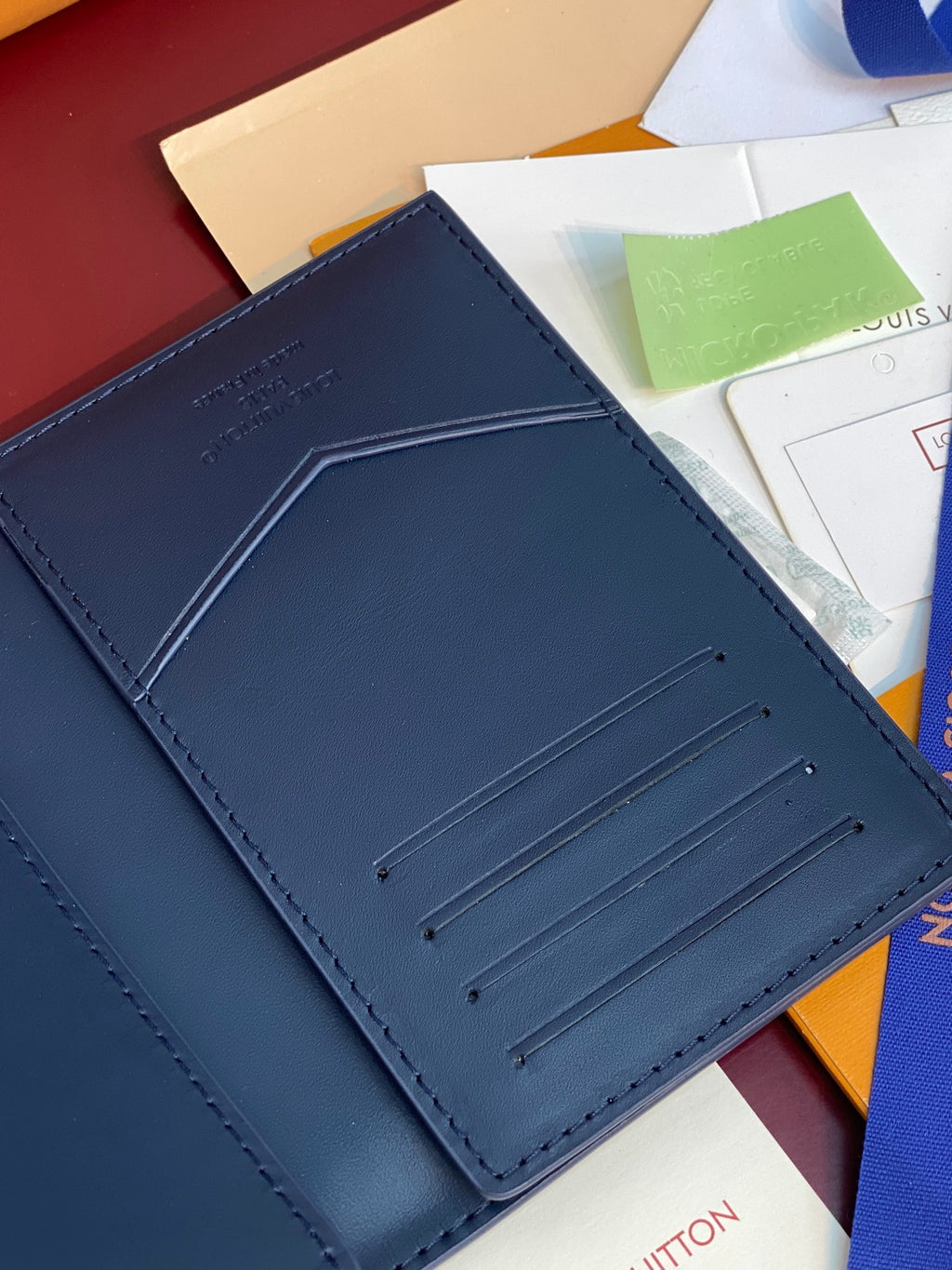 Louis Vuitton small card wallet close-up, dark blue card holder with stitched lines