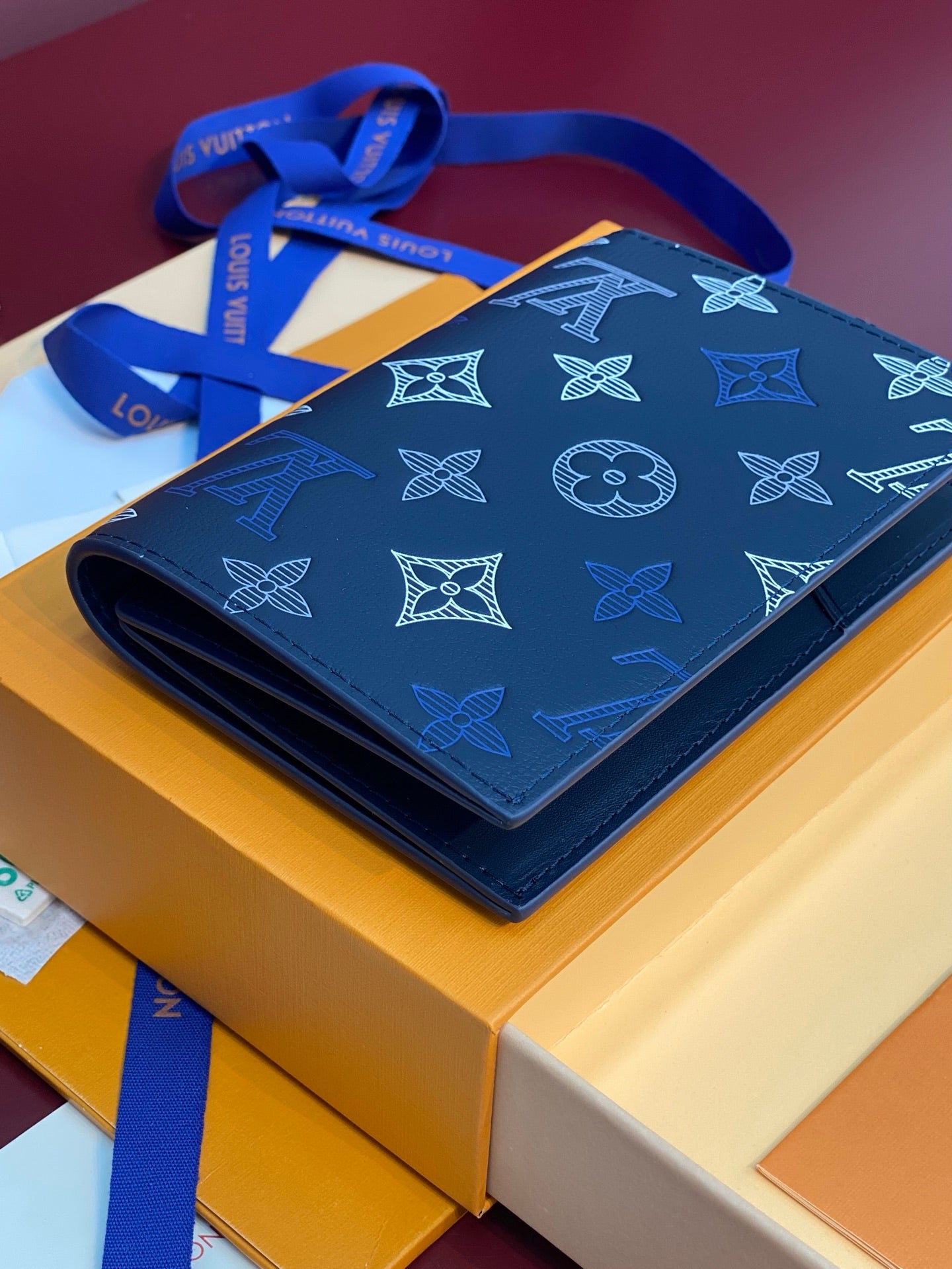 Louis Vuitton small bag in blue with monogram pattern, fold-over flap