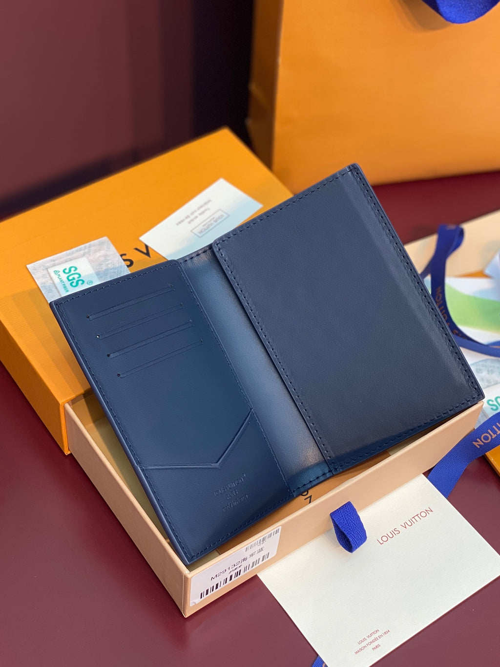 Louis Vuitton small card wallet opened, dark blue leather with card slots