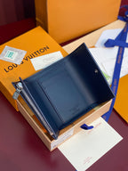 Louis Vuitton zip wallet with smooth dark blue interior and gold zipper hardware