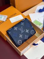 Navy patterned small wallet with foldover flap and visible card slots