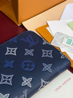 Louis Vuitton blue monogram small zip pouch with repeating white pattern