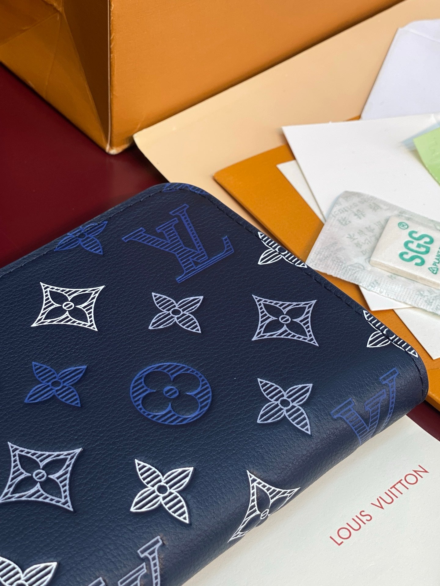 Louis Vuitton blue monogram small zip pouch with repeating white pattern