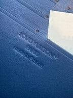 Louis Vuitton blue textured leather wallet exterior with embossed logo and tag