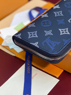 Louis Vuitton blue monogram small zip wallet with wrist strap and silver zipper
