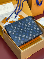 Blue monogram small bag with zip closure and blue wrist strap