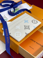 Louis Vuitton small bag with blue-and-white monogram print and blue strap