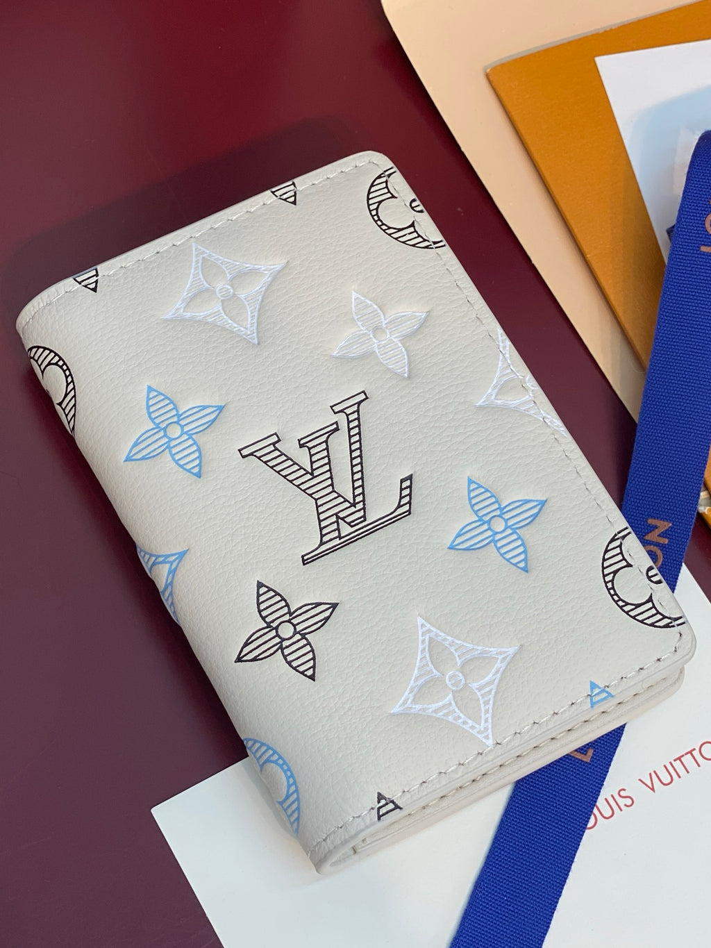Louis Vuitton card holder, white leather with blue and black monogram motifs