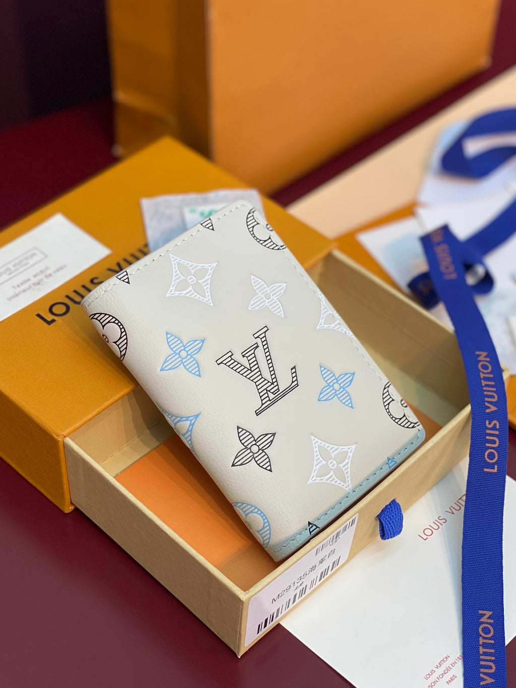 Louis Vuitton card holder, white leather with blue and black monogram pattern