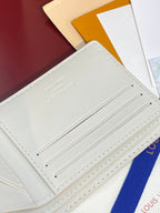 Louis Vuitton small bi-fold card holder, interior card slots with stitched trim