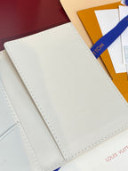Men’s Louis Vuitton small wallet back panel on white leather, minimal embossing