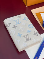 Men’s Louis Vuitton small wallet, patterned white leather with light-blue monograms