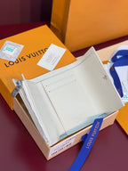 Louis Vuitton zip card case, smooth white exterior with card slots and metal zipper