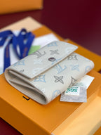 Louis Vuitton men's small bag with flap and blue monogram pattern, light beige