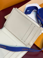White small wallet with zipper closure and stitched panels, top corner detail