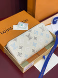 Louis Vuitton monogram zip wallet in white with blue icons pattern
