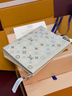 Louis Vuitton monogram clutch bag in light cream with blue icon details and trim