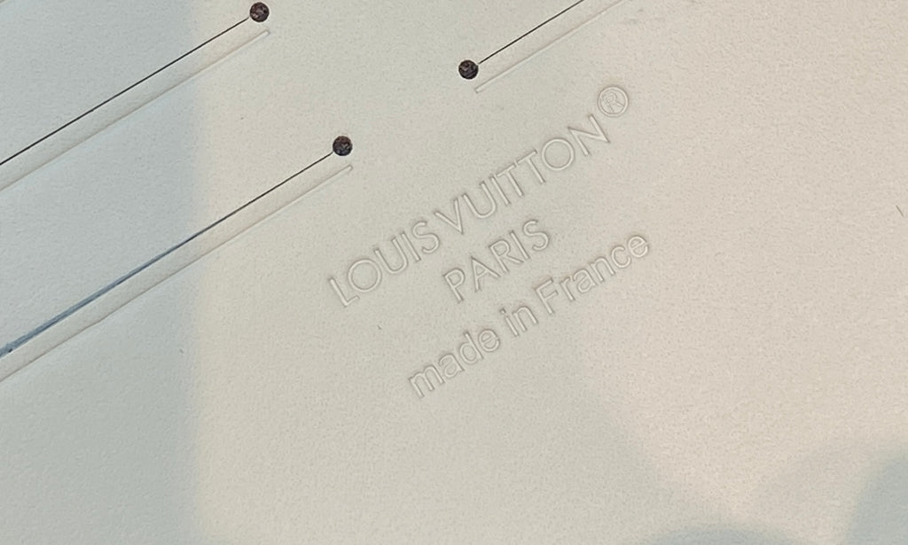 Louis Vuitton Paris made in France embossing on cream leather