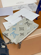 Louis Vuitton small zip bag with multicolor monogram pattern, white exterior and metal hardware