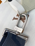 Louis Vuitton small bag metal hardware close-up with navy textured strap and clasp