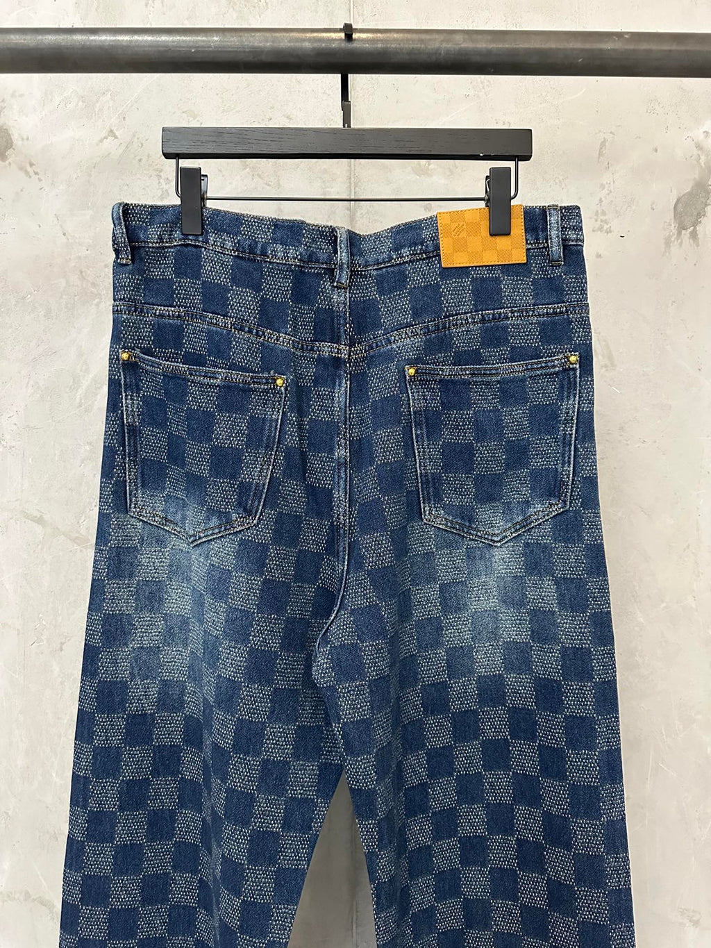 Denim check-pattern pants with front pockets and belt loops, blue wash