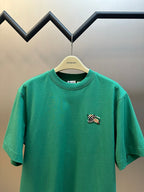 Green short-sleeve T-shirt with embroidered crest on front