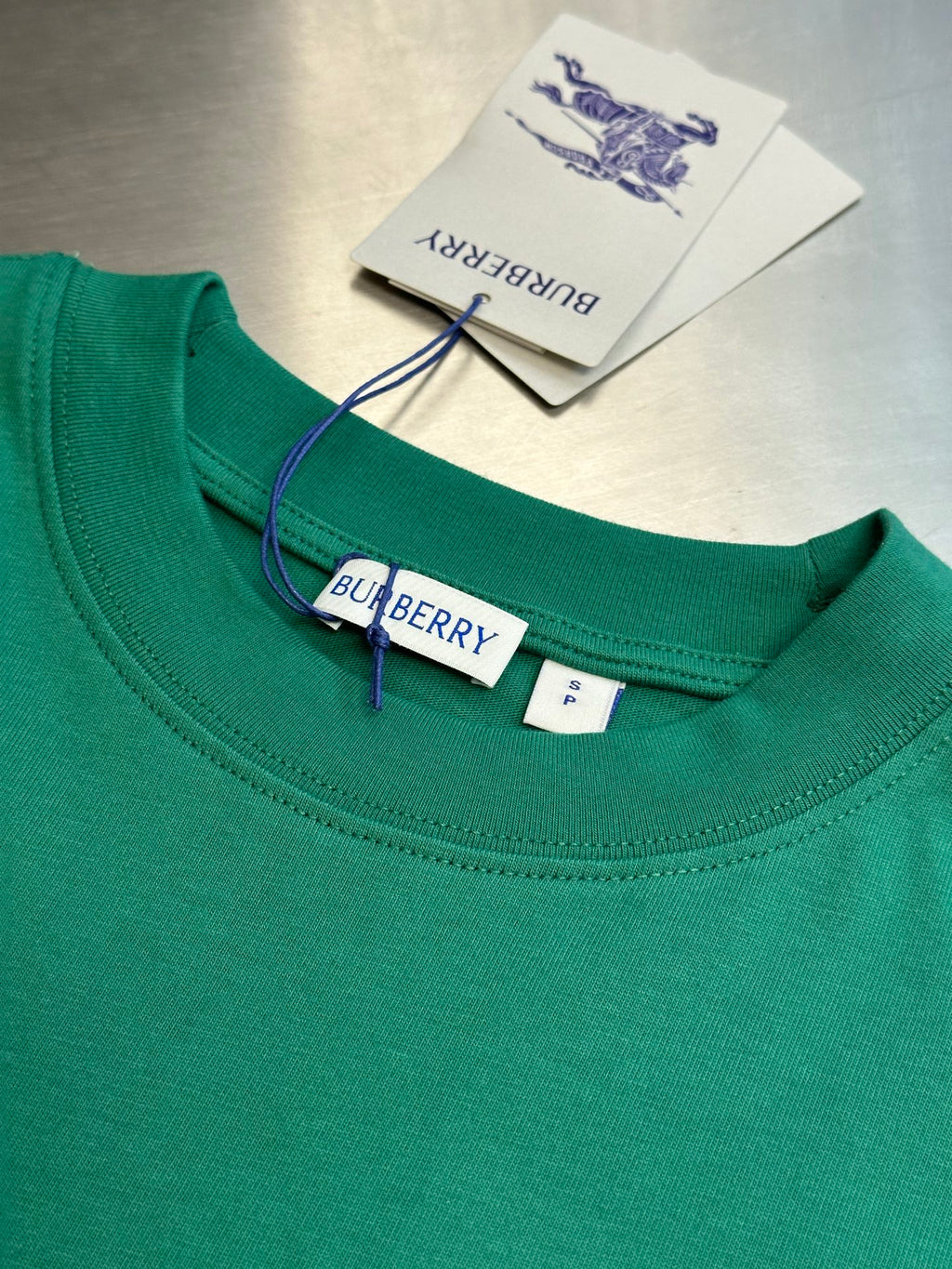 Green crewneck short-sleeve T-shirt with Burberry label and neck tag