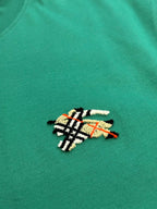 Green short-sleeve T-shirt with colorful embroidered crest emblem