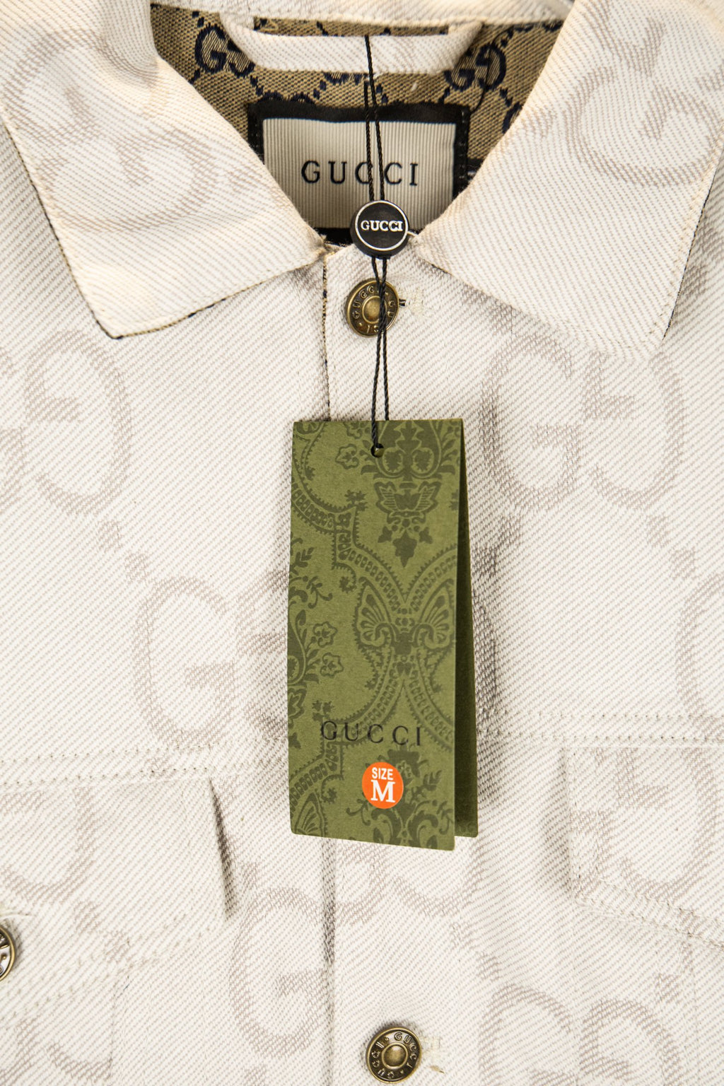 Gucci GG-print white jacket with green hang tag and gold-tone button