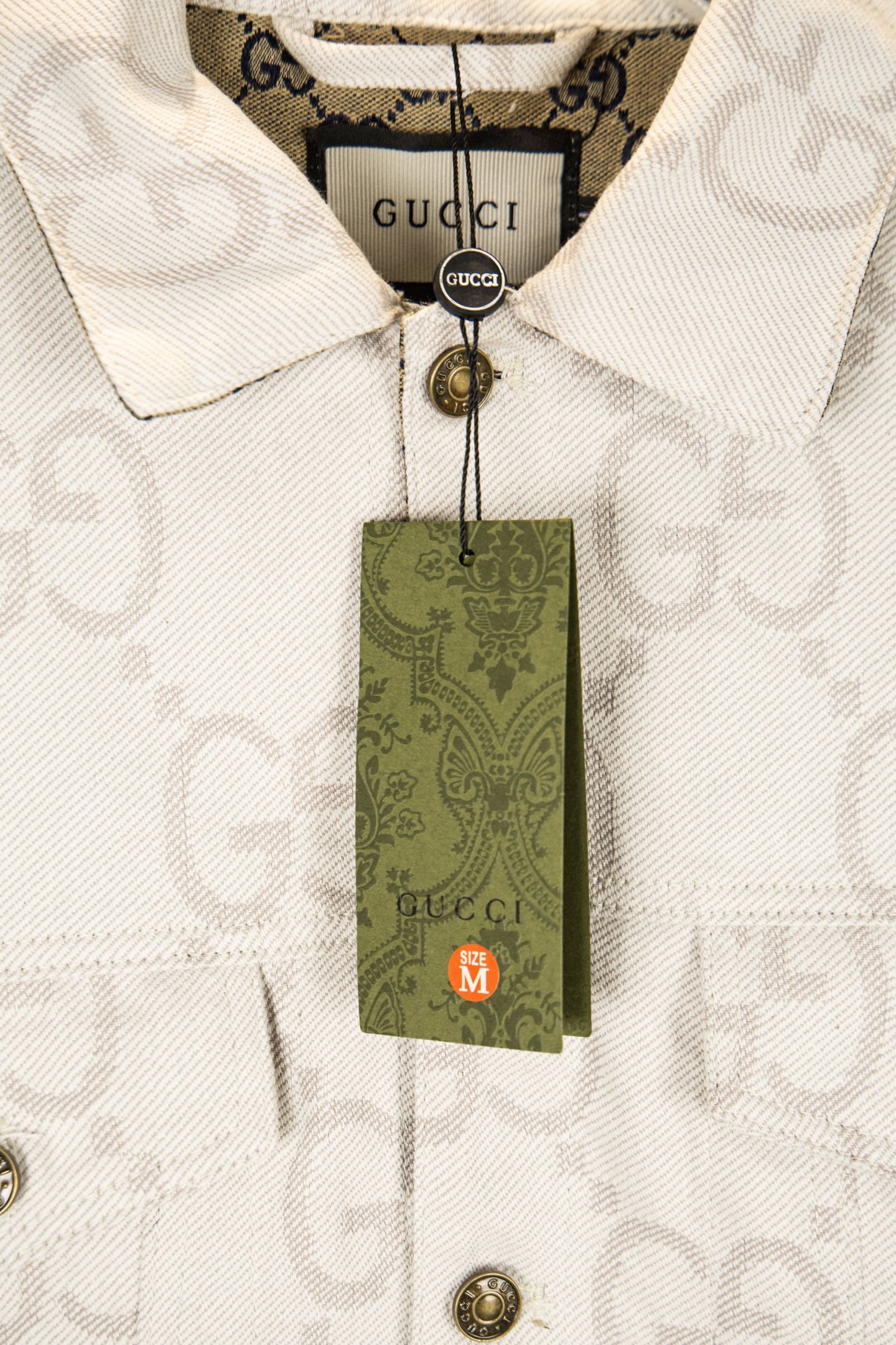 Gucci GG-print white jacket with green hang tag and gold-tone button
