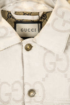 Gucci GG-print white jacket close-up of collar and gold-tone buttons