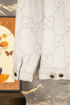 Gucci GG-print white jacket sleeve cuff with buttoned detail and gold-tone button