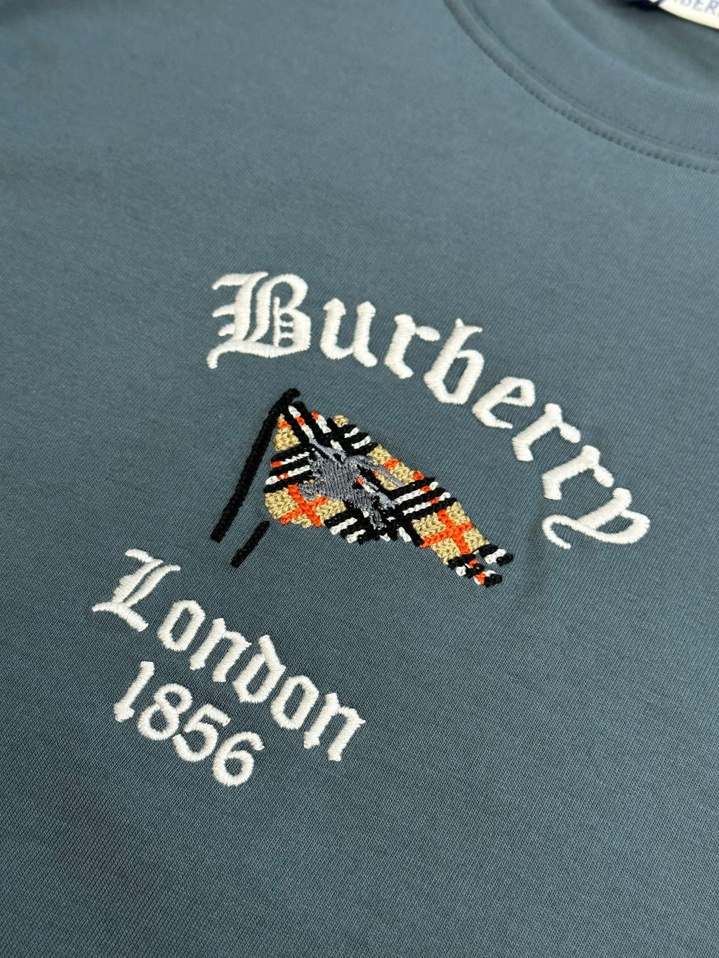 Embroidered Burberry London 1856 logo on blue short-sleeve T-shirt chest