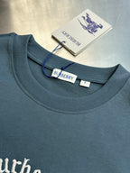 Blue crew-neck T-shirt with stitched collar and Burberry brand tag at neckline