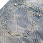 Denim patch pocket with white snap and yellow trim stitching