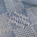 Embroidered blue floral pattern on light denim
