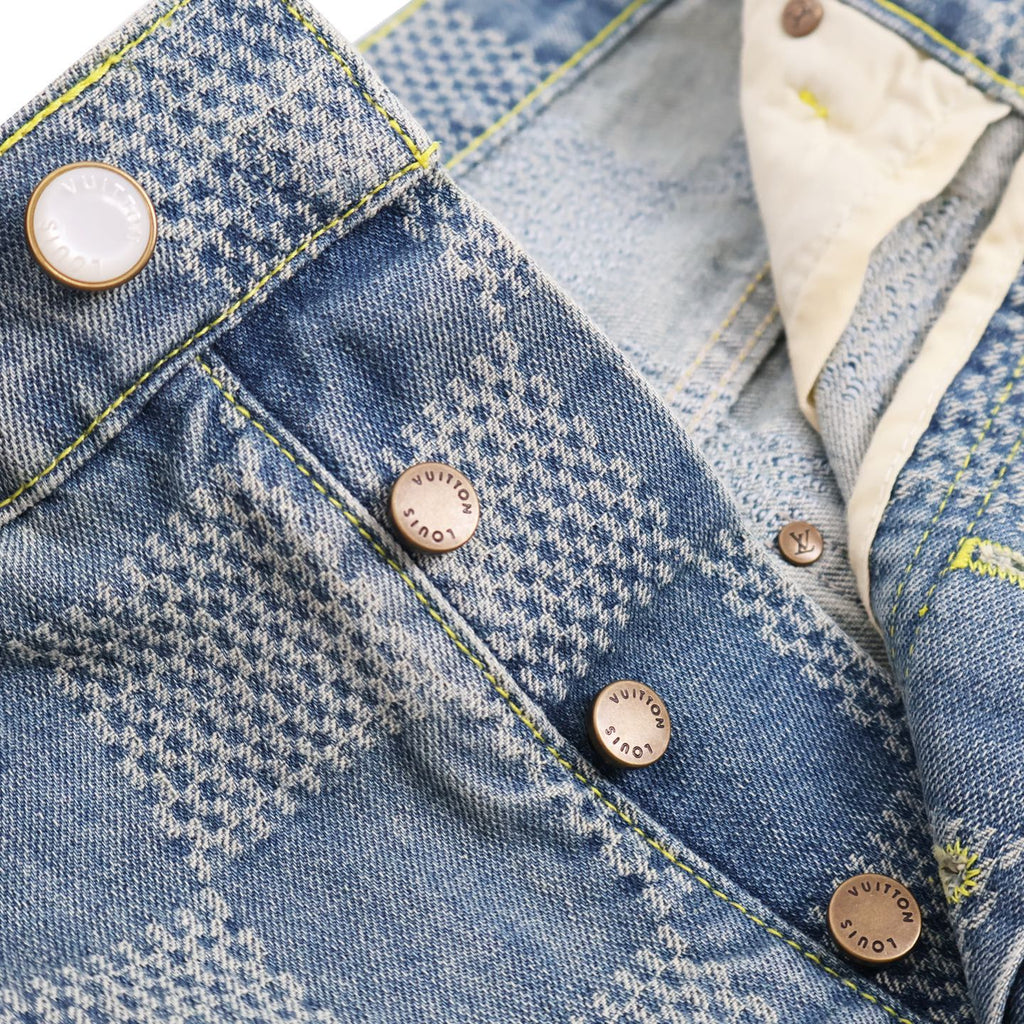 Denim pocket panel with snap buttons and yellow contrast stitching