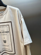 Cream T-shirt sleeve with partial framed graphic print