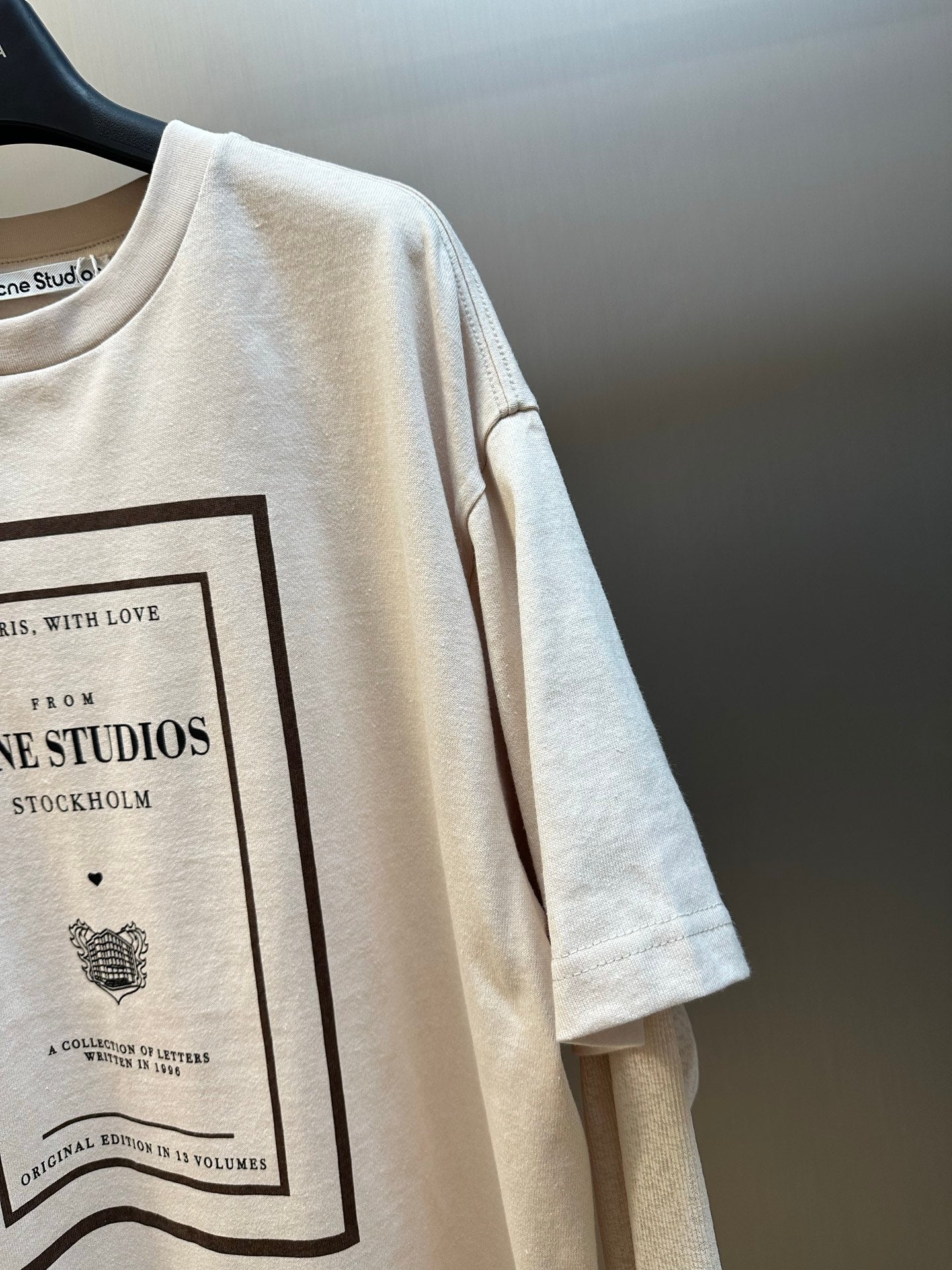 Cream T-shirt sleeve with partial framed graphic print