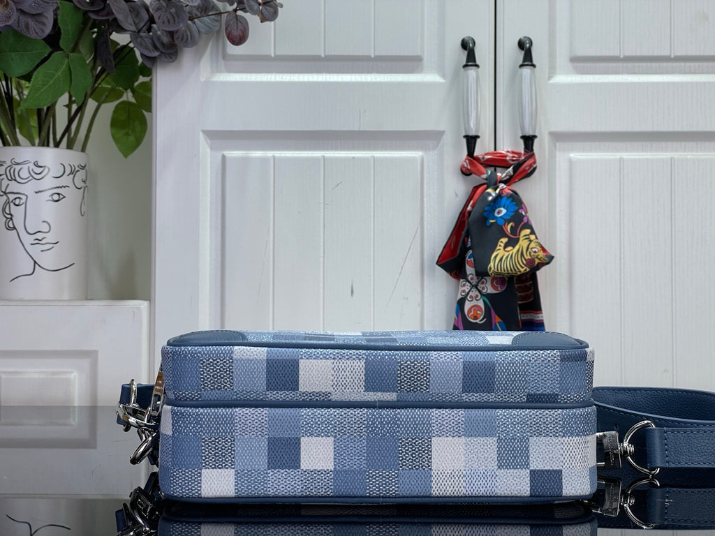 Louis Vuitton check mini bag in blue with top handle, layered zippers, and charm