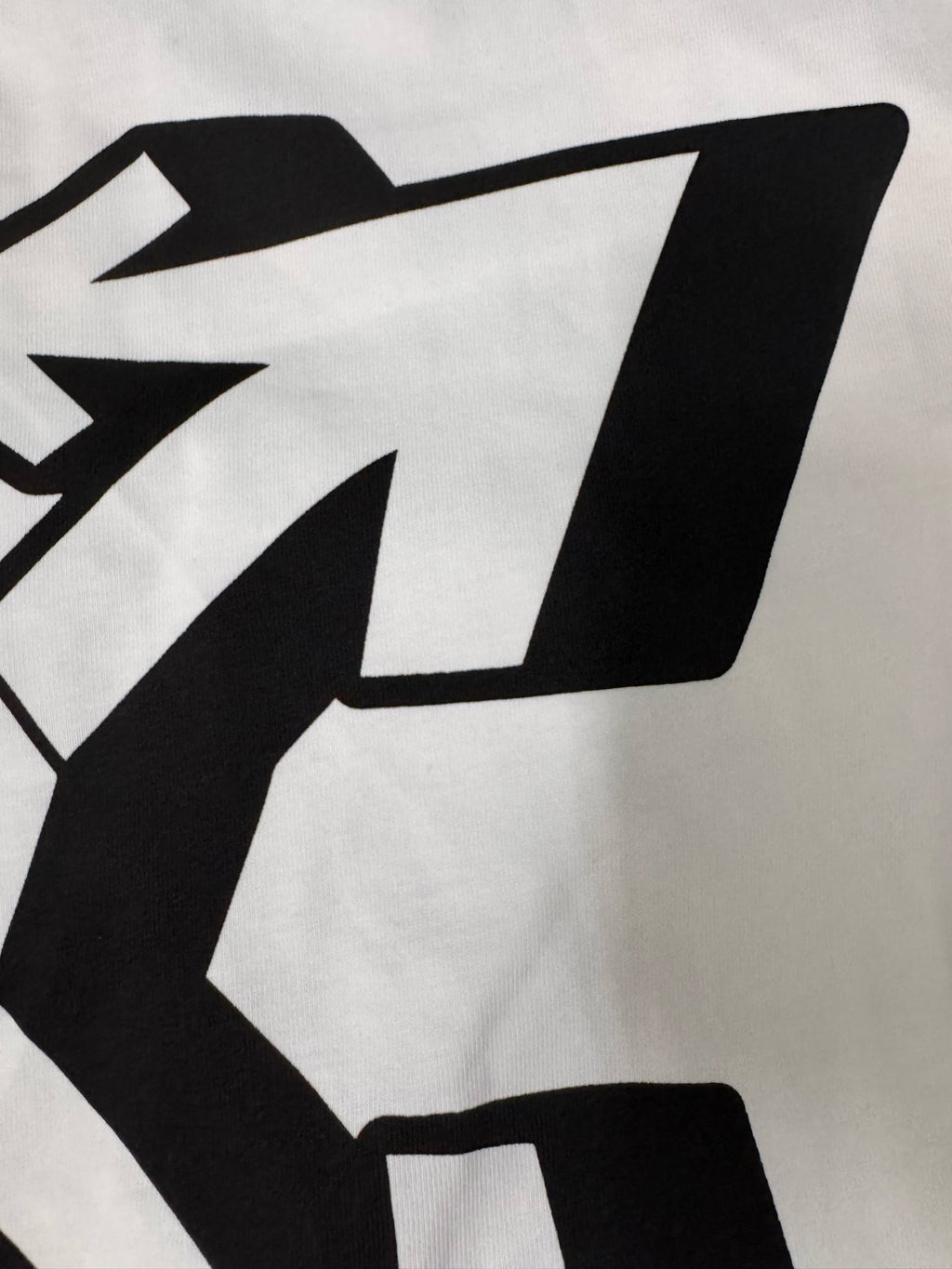 Off White white T-shirt close-up of large black logo graphic