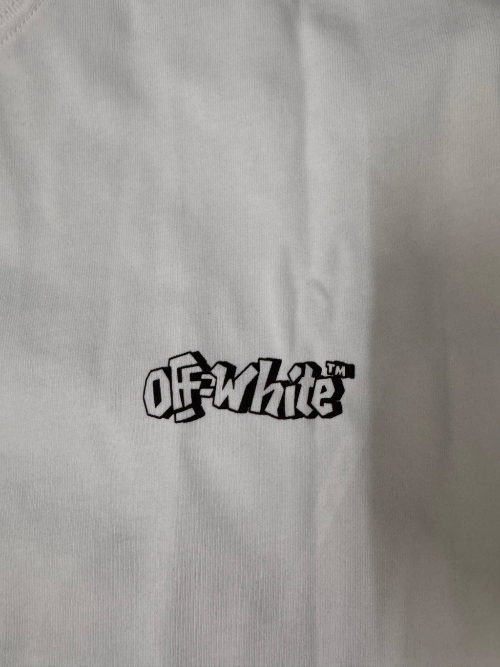 Off White logo on white crew-neck T-shirt chest, black text graphic