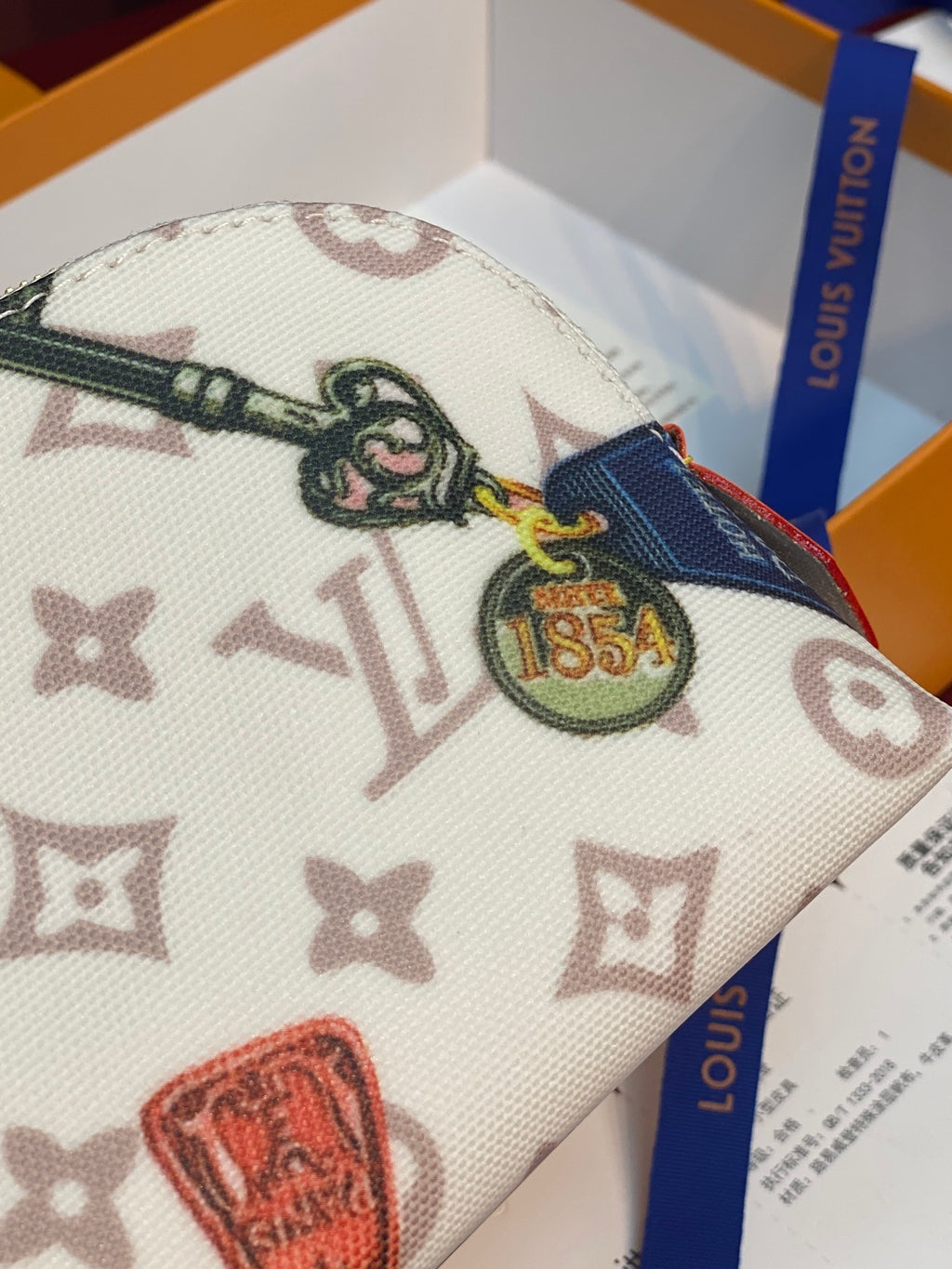 Louis Vuitton multicolor monogram pouch with emblem patch and blue zipper tape