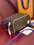 Louis Vuitton monogram belt bag with blue strap, curved silhouette, and white piping