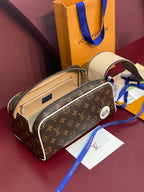 Louis Vuitton monogram belt bag with open top view, blue strap, and tan interior