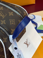 Louis Vuitton monogram belt bag with blue strap and white paper tags attached