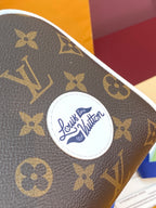 Louis Vuitton monogram canvas with circular logo badge and white edge trim